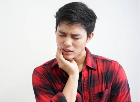 Image of a man having Tooth Pain